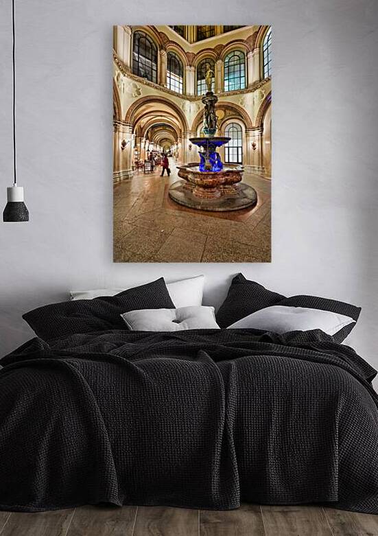 Ornate indoor arcade with fountain and people. by Marco Brivio