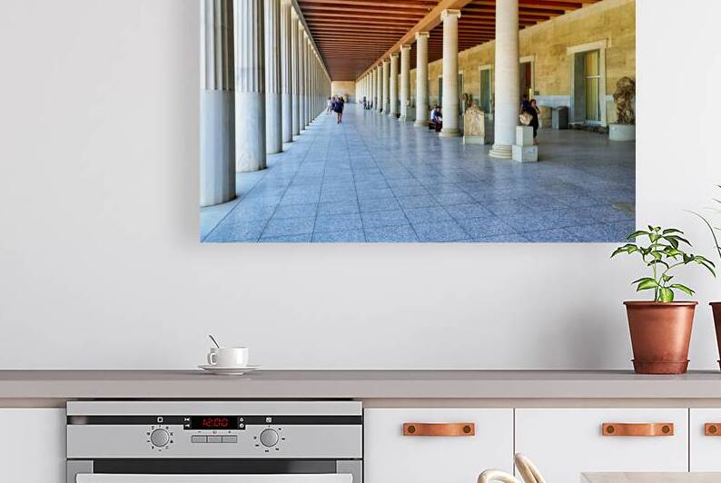 People walk through the Stoa of Attalos in Athens Greece by Marco Brivio