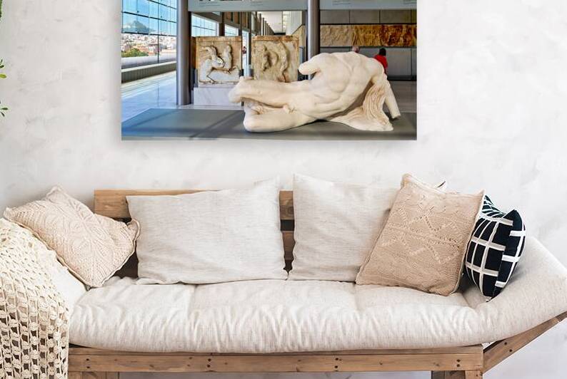 Visitors explore sculptures at Acropolis Museum in Athens Greece by Marco Brivio