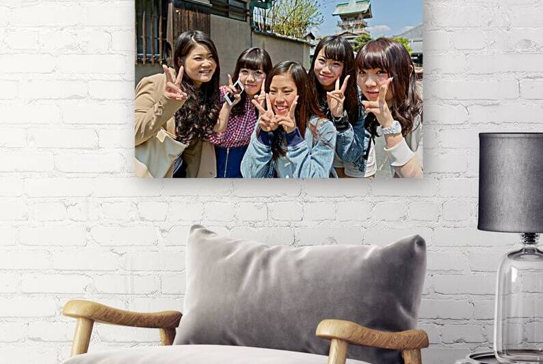 Young girls smiling in Kyoto while enjoying the day together by Marco Brivio