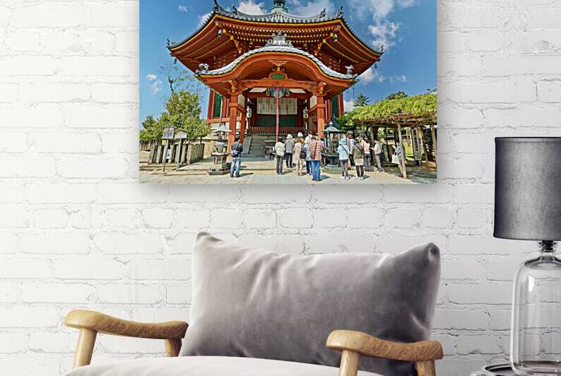 Visitors are praying at a temple in Nara Japan by Marco Brivio