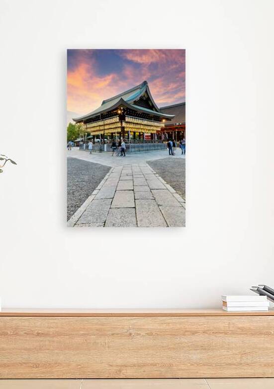 Yasaka shrine temple in Kyoto with visitors at sunset by Marco Brivio