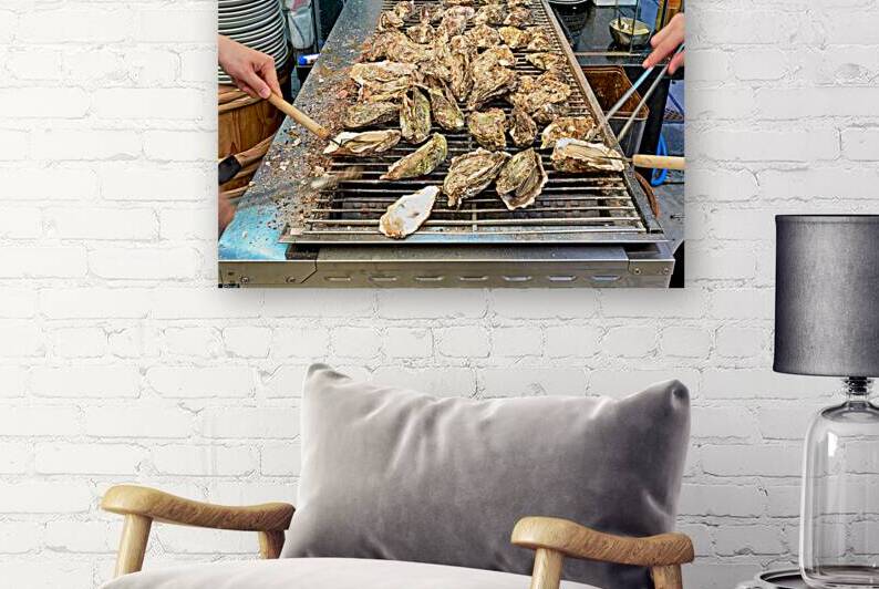 Grilling oysters in restaurant on Miyajima island in Hiroshima by Marco Brivio