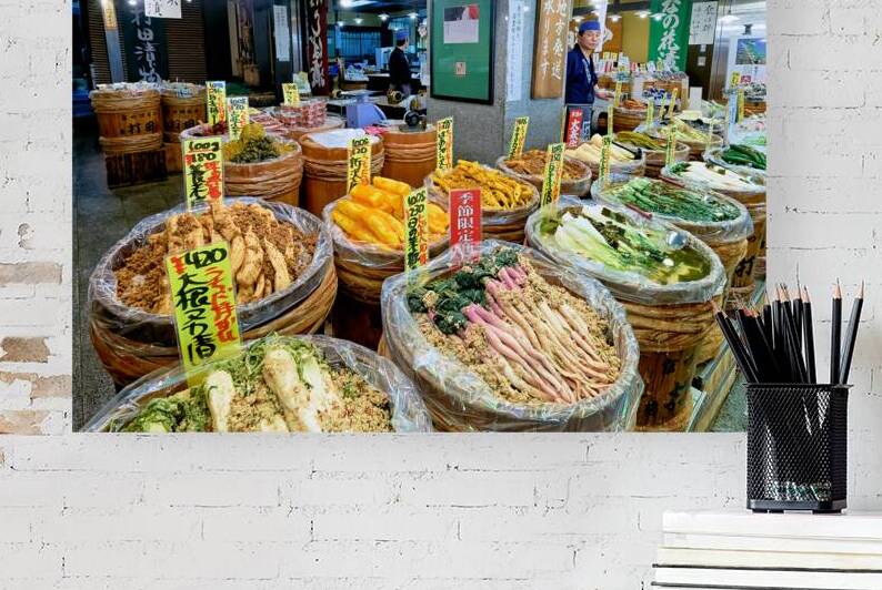 Nishiki Market in Kyoto shows local food vendors selling vegetab by Marco Brivio