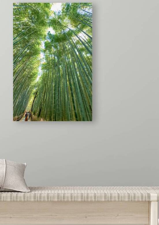 People walk through the tall bamboo trees in Arashiyama Bamboo G by Marco Brivio