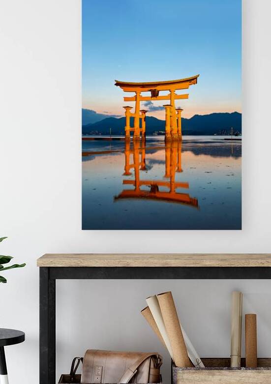 Sunset at Itsukushima Shrine with floating torii gate in Japan by Marco Brivio