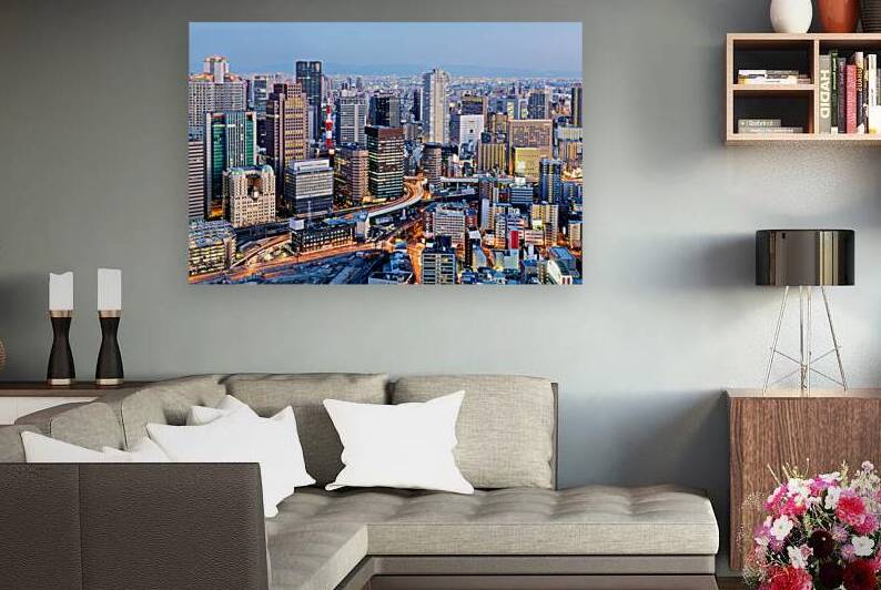 Osaka business district at dusk with city lights and buildings by Marco Brivio