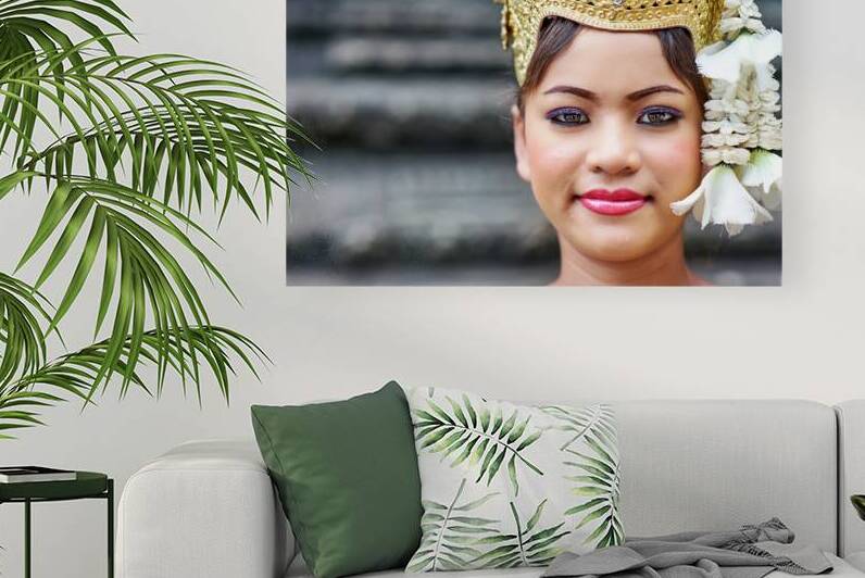 Close up of woman in traditional golden crown and white flowers. by Marco Brivio