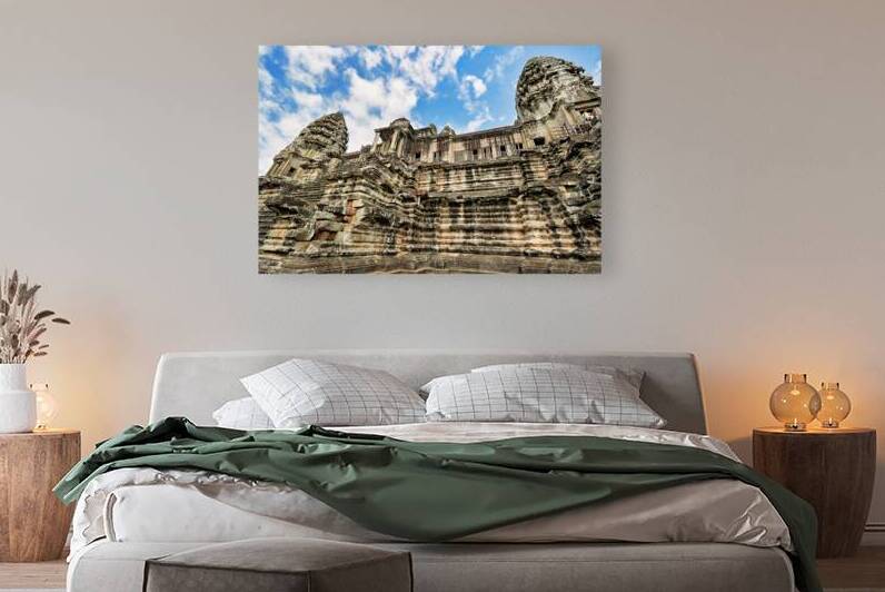 Angkor Wat temple ancient stone architecture against blue sky. by Marco Brivio