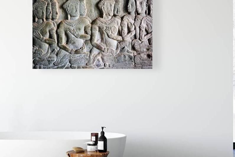 Stone bas relief of Apsara dancers from an ancient temple. by Marco Brivio