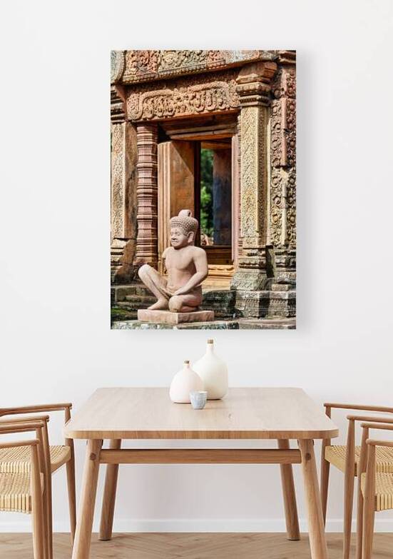 Ancient Cambodian temple with intricate carvings and stone statu by Marco Brivio