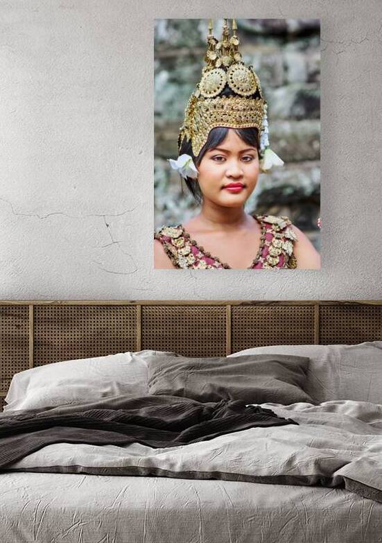 Traditional Cambodian dancer in ornate golden headdress. by Marco Brivio