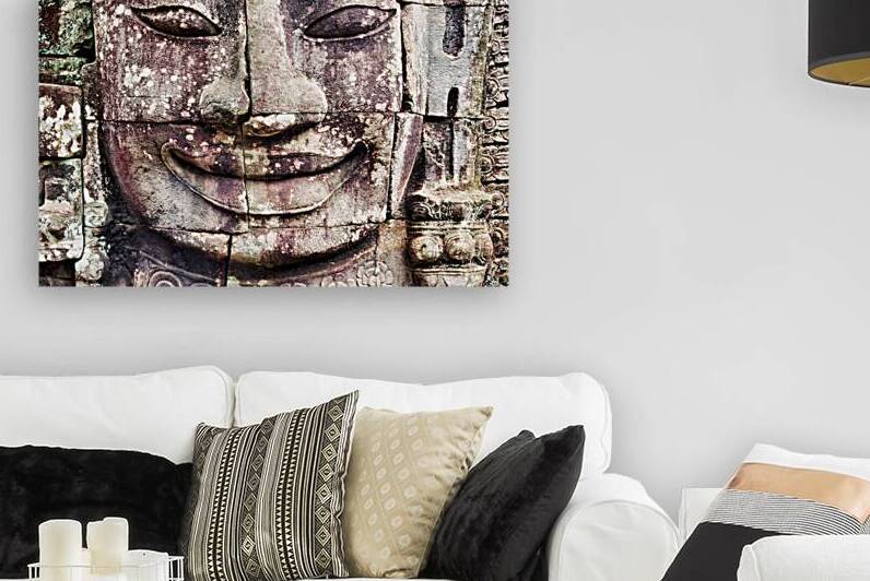 Ancient stone face carving with serene expression. by Marco Brivio