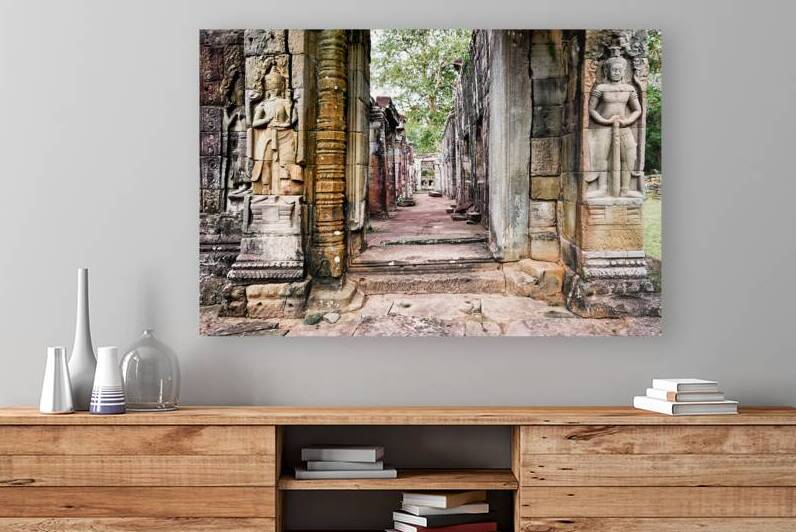 Ancient stone temple ruins with carved figures. by Marco Brivio