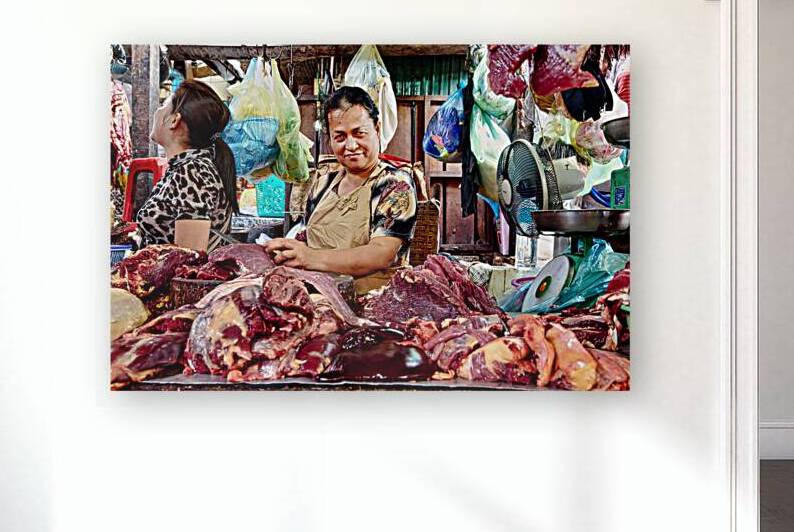 Market vendor with fresh meat display. by Marco Brivio