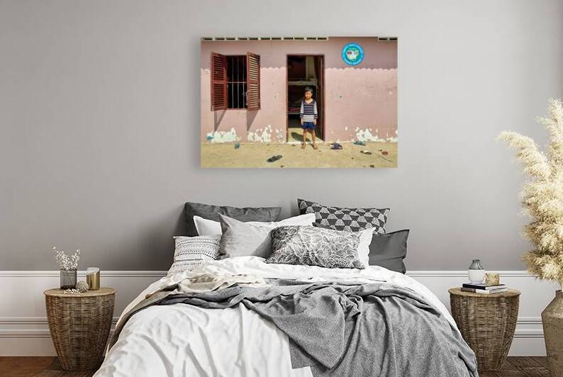Barefoot boy in front of Lighthouse building. by Marco Brivio