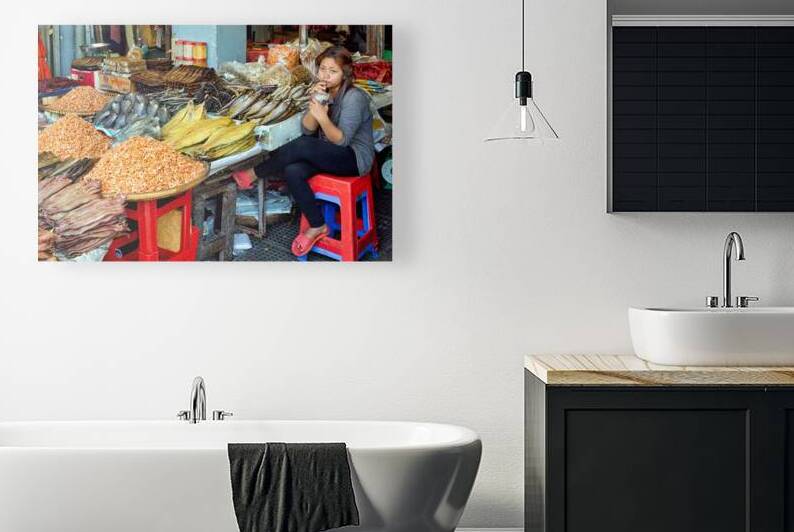 Woman selling dried seafood and shrimp at market. by Marco Brivio