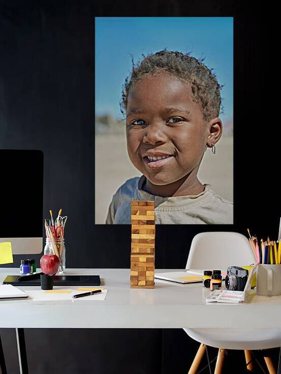 Portrait of a child in Damaraland village in Namibia by Marco Brivio