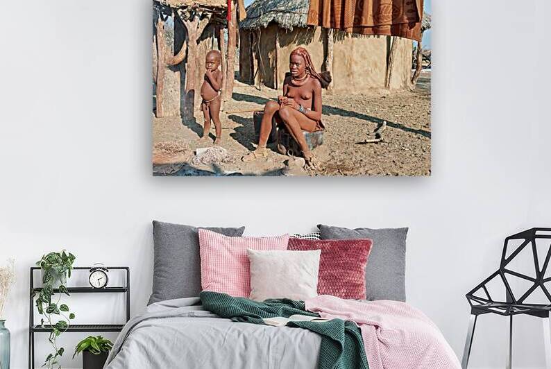 Himba women and children engage in daily life in Kunene Region by Marco Brivio