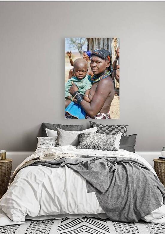 Portrait of young Zemba woman holding child in Kunene Region by Marco Brivio