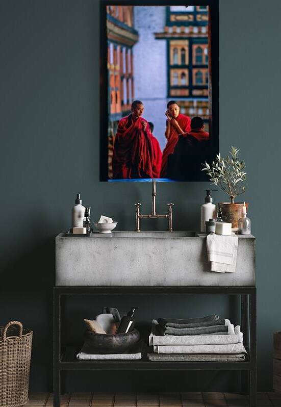 Bhutanese monks using a mobile phone. by Marco Brivio