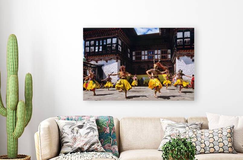 Colorful masked dancers perform traditional festival in Bhutan. by Marco Brivio