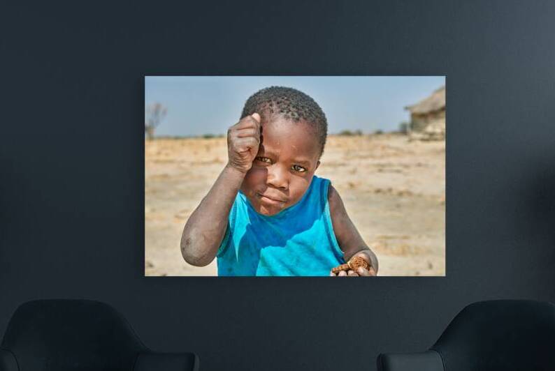Joyful boy in Kavango Region playing in Namibia by Marco Brivio
