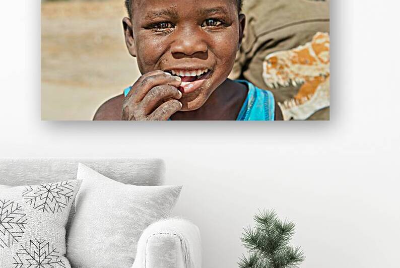 Portrait of a joyful boy in Kavango Region Namibia by Marco Brivio