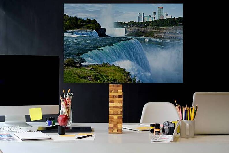 Niagara Falls with city skyline and boat. by Marco Brivio