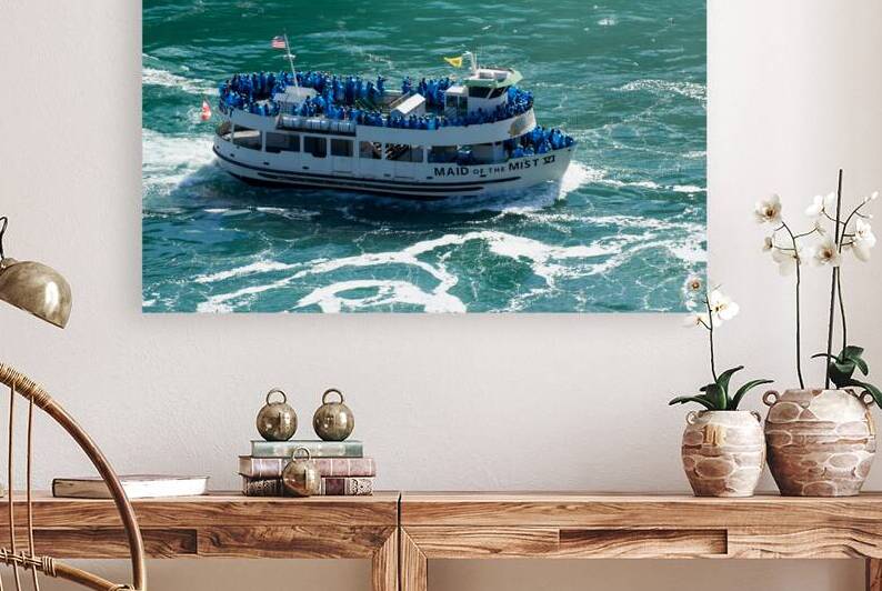 Maid of the Mist boat carrying tourists through water. by Marco Brivio