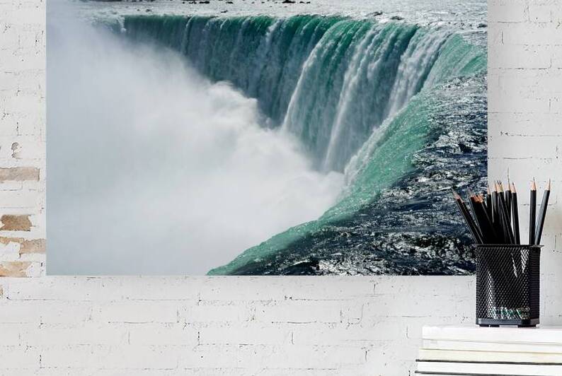 Powerful Niagara Falls cascading creating immense mist. by Marco Brivio