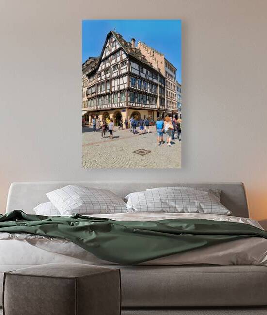 Visitors enjoy timber frame houses in Place du Chateau in Strasb by Marco Brivio