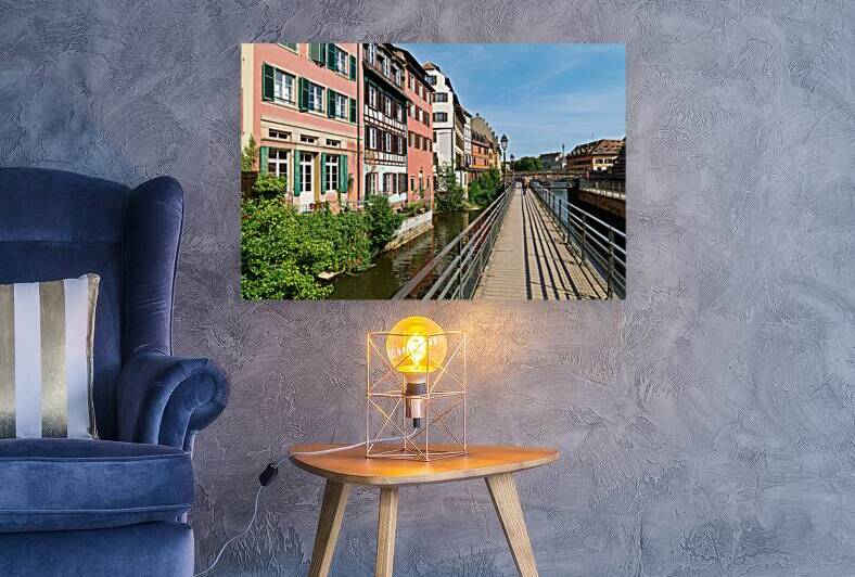Visitors walk along the canal in Petit France Strasbourg by Marco Brivio