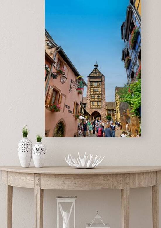 Tourists stroll through historic streets in Riquewihr Alsace by Marco Brivio