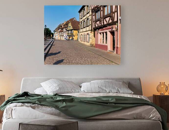 Visitors stroll along cobblestone street in Petite Venise Colmar by Marco Brivio