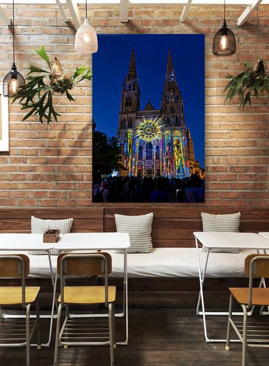 Cathedral in Chartres France lit up at night with colorful proje by Marco Brivio