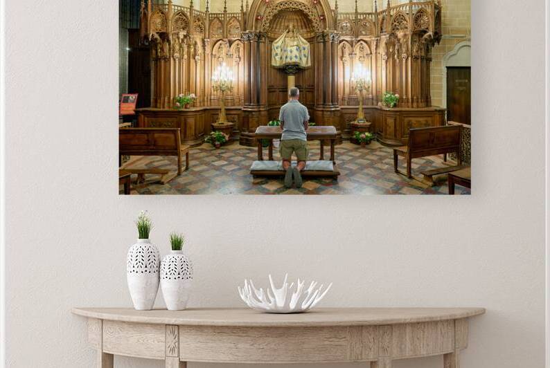 Praying in a chapel at Chartres Cathedral in France by Marco Brivio