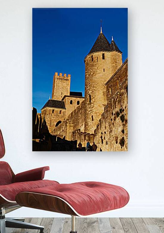 Walking along the ancient walls of Carcassonne in France during  by Marco Brivio