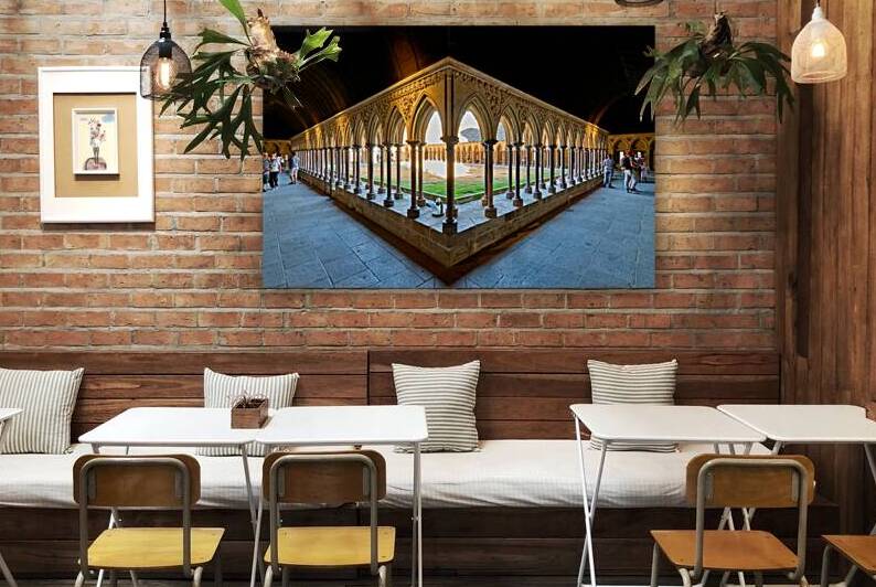 Exploring the cloister at Mont Saint Michel abbey in Normandy Fr by Marco Brivio