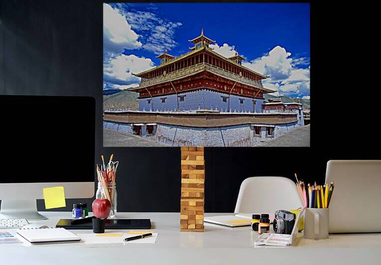 Golden roof of ancient Tibetan monastery under blue sky by Marco Brivio