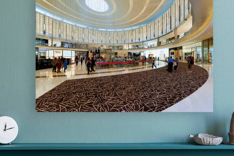 Modern shopping mall in Dubai with people and luxury brands by Marco Brivio