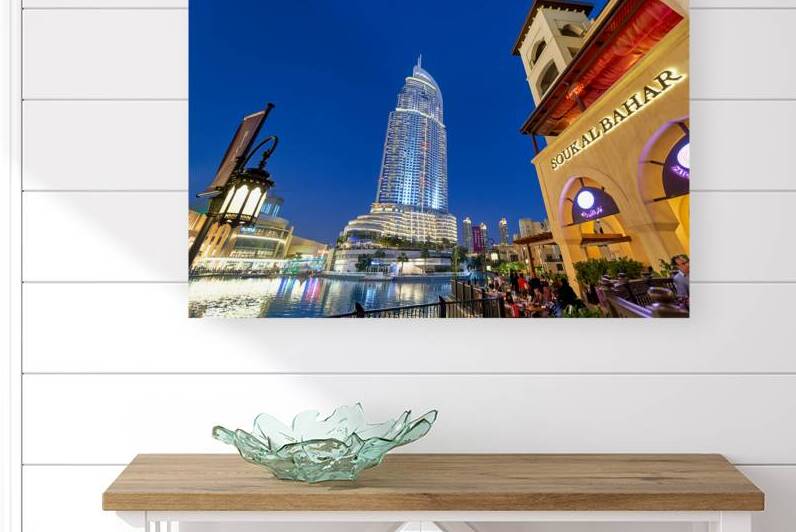 Night lights and waterfront dining in Dubai cityscape by Marco Brivio