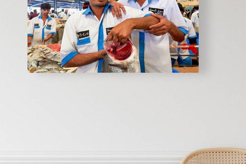 Fishmongers show fresh catch at market in Dubai UAE by Marco Brivio