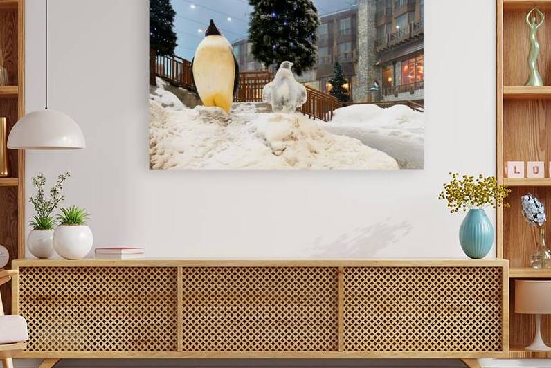 Winter wonderland in Dubai featuring penguin statues and trees by Marco Brivio