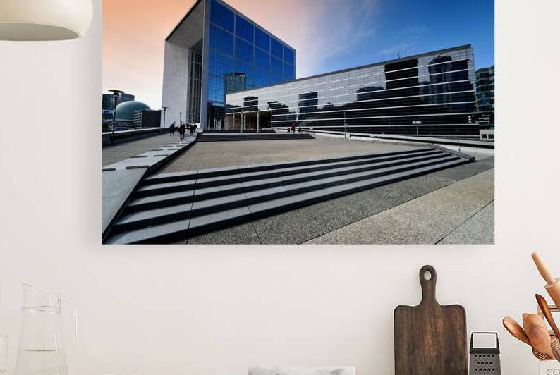 Visitors explore La Defense in Paris during a bright afternoon by Marco Brivio