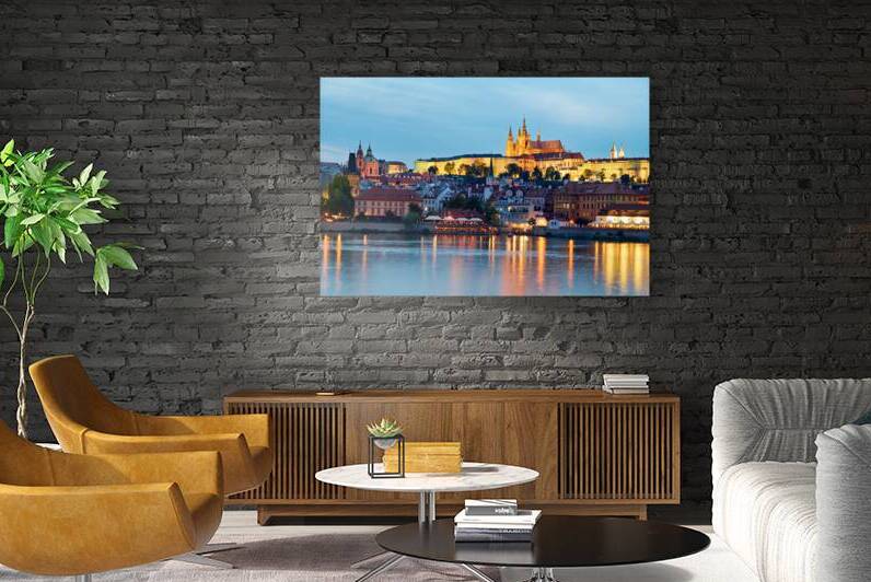 Prague cityscape at night with castle and river reflections. by Marco Brivio