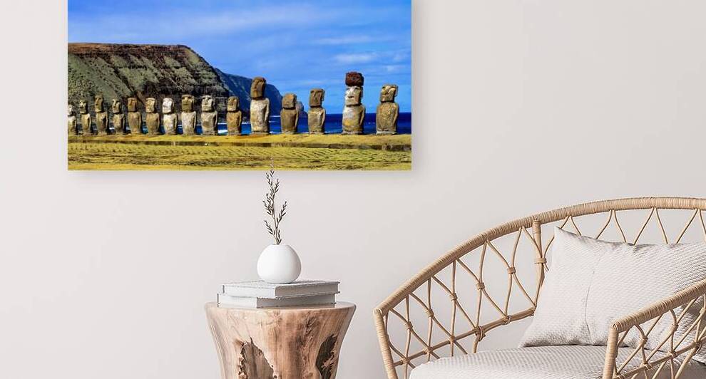 Easter Island Moai statues against ocean and cliffs. by Marco Brivio