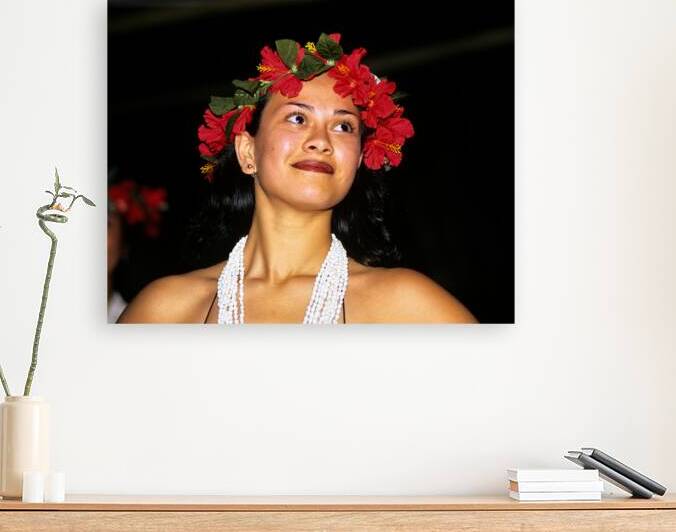 Woman wears red flower crown and shell necklace in Easter Island by Marco Brivio