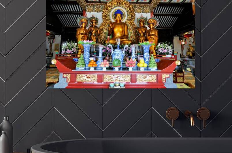 Visitors observe golden statues in Shanghai Buddhist temple inte by Marco Brivio