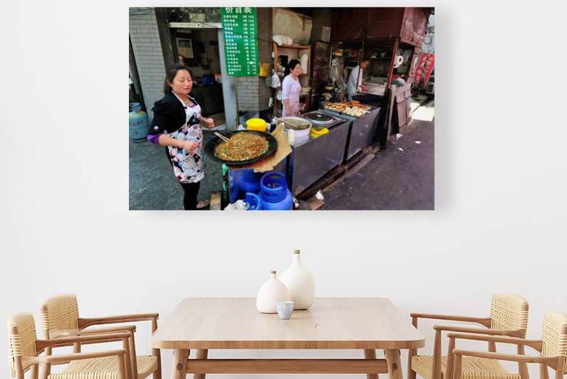 Vendors prepare noodles and fried items in Shanghai street marke by Marco Brivio